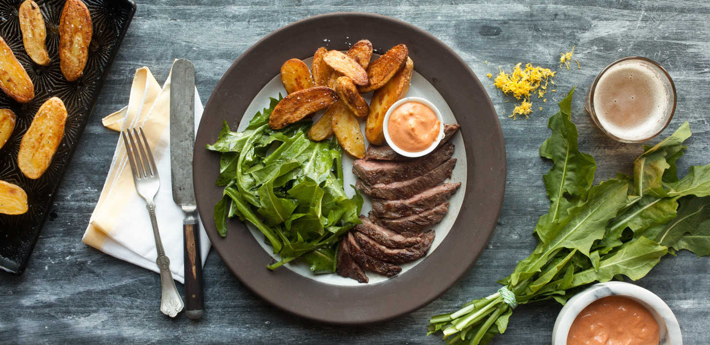 hero__Skirt_Steak_with_Dandelion_Greens__Papas_Bravas__and_Paprika_Aioli_hero