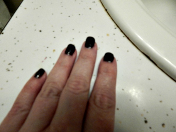 The polish looks much darker than it really is in the photo. It is actually a dark, deep gray.