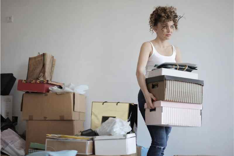 Top 12 Tips for Reducing Stress When Moving - woman moving